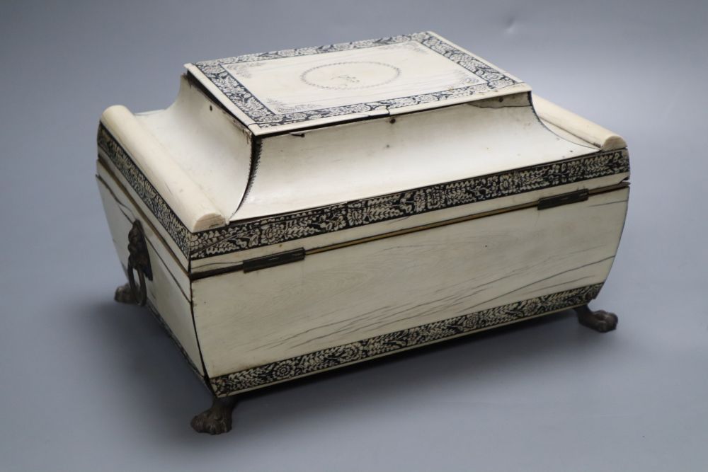 An early 19th century Anglo-Indian Vizagapatam dressing table box, of sarcophagus form, with lion paw feet, width 27cm